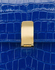 Leather top handle bag, cobalt croc, lock closeup