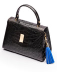 Decorative leather tassel, cobalt, on a bag
