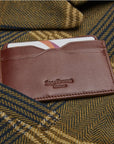 Flat leather credit card case with ID window, dark tan, lifestyle