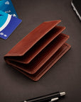 Leather bifold card wallet, dark tan, lifestyle