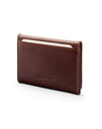 Leather tri-fold travel card holder, dark tan with cream, back