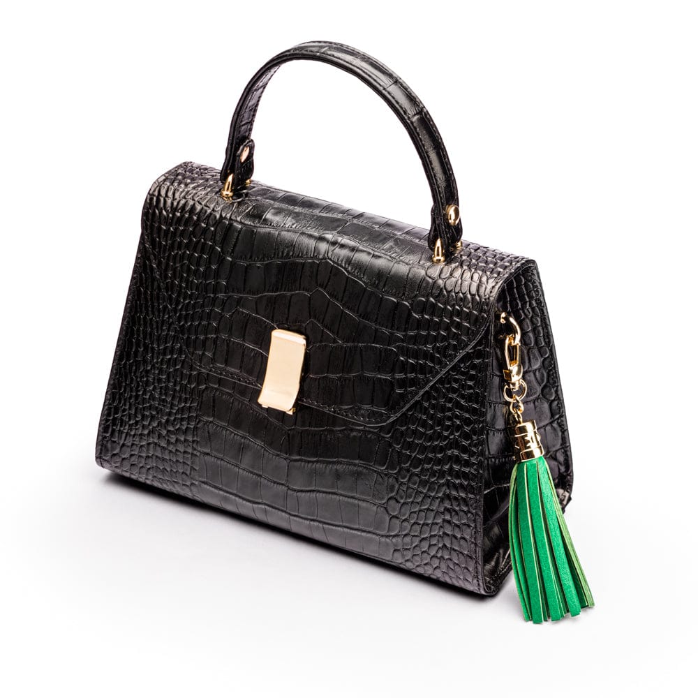 Decorative leather tassel, emerald green, on a bag