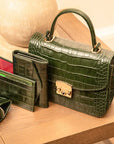 Small leather top handle bag, green croc, lifestyle