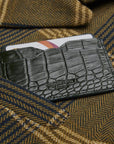 Flat leather credit card case with ID window, green croc, lifestyle