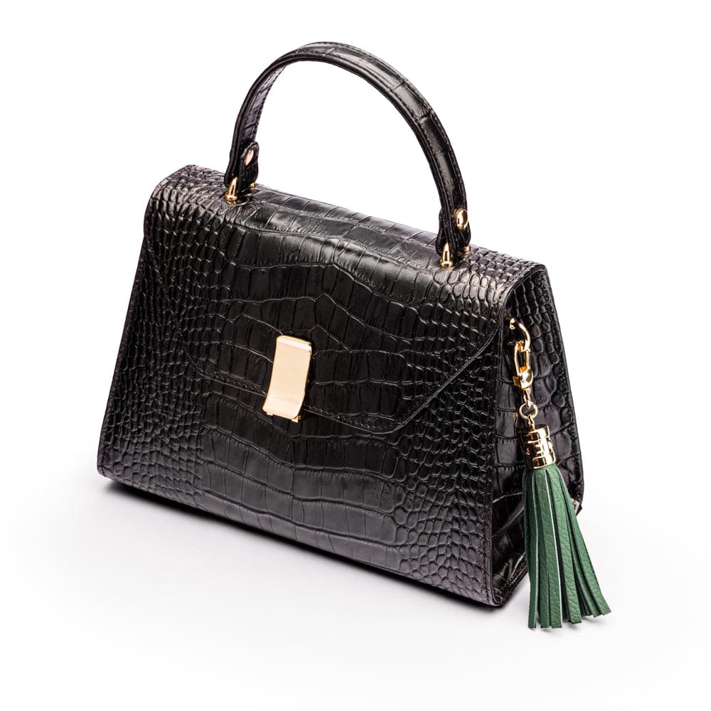 Decorative leather tassel, green, on a bag