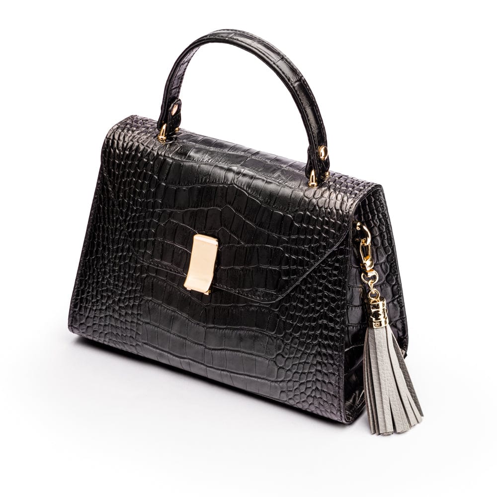 Decorative leather tassel, grey, on a bag