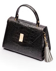 Decorative leather tassel, grey, on a bag