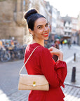 Leather clutch bag, ivory croc, lifestyle view