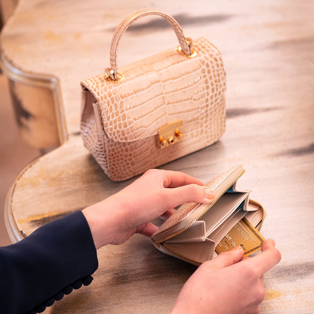 Smallzip around accordion coin purse, ivory croc, lifestyle