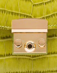 Small leather top handle bag, lime green croc, lock close up