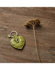 Leather heart shaped key ring, lime croc, lifestyle
