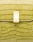 Leather top handle bag, lime green croc, lock closeup