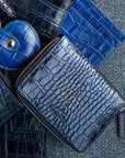 Small leather zip around accordion coin purse, navy croc, lifestyle
