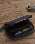 Small leather zip around coin purse, navy, lifestyle