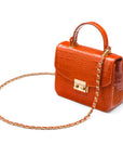 Small leather top handle bag, orange croc, side