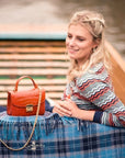 Small leather top handle bag, orange croc, lifestyle