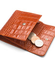 Leather purse with brass clasp, orange croc, open