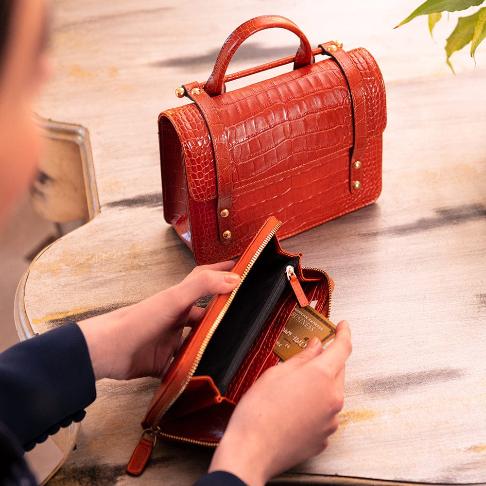 Tall leather zip around accordion purse, orange croc, lifestyle
