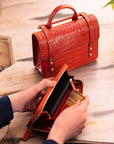 Tall leather zip around accordion purse, orange croc, lifestyle
