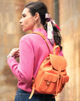 Small leather backpack, orange , lifestyle