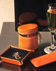 Small leather valet tray, orange with black, lifestyle