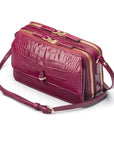 Compact crossbody bag, pink croc, side