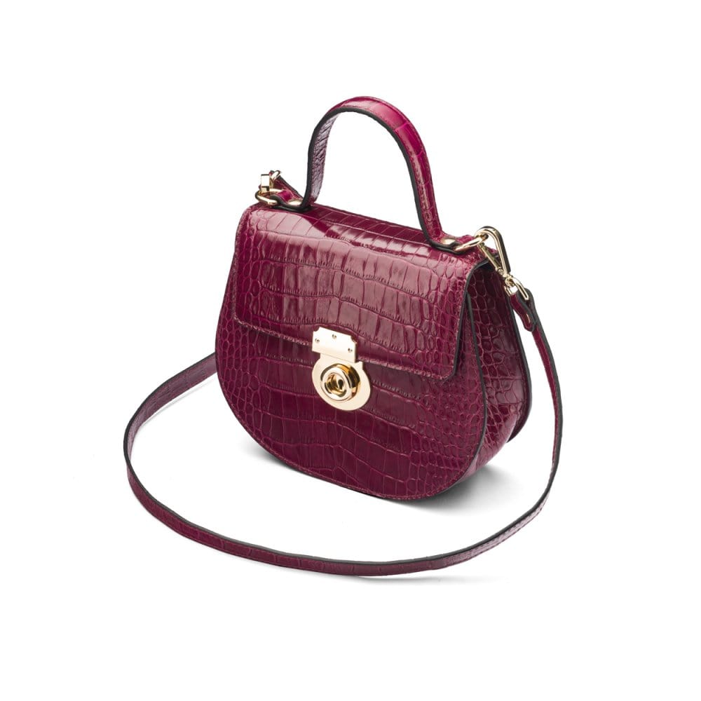 Leather rounded bottom top handle bag, pink croc, side