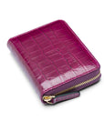 Small leather zip around accordion coin purse, pink croc, front