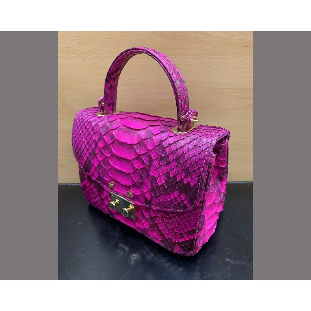 Small real python top handle bag, pink, side
