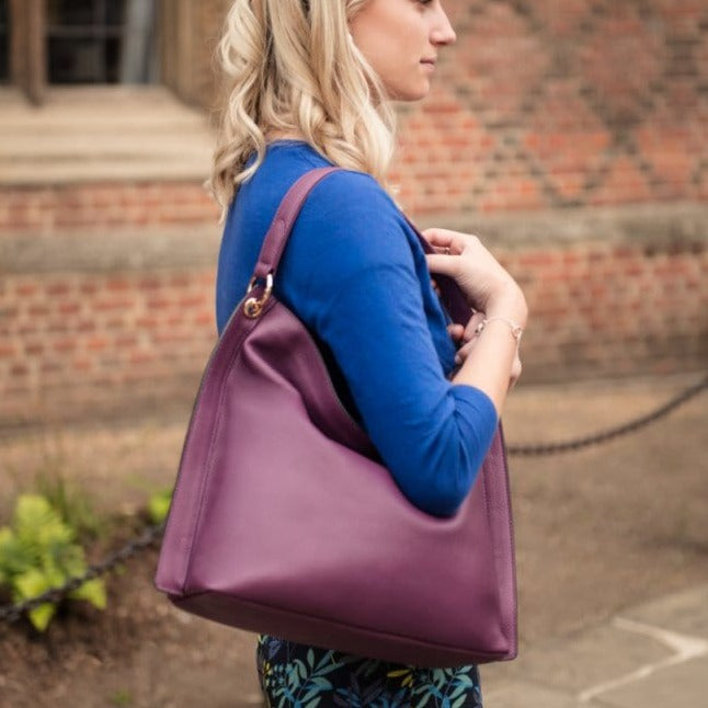 Slouchy leather shoulder bag, purple, lifestyle
