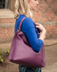 Slouchy leather shoulder bag, purple, lifestyle
