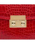 Small leather top handle bag, red croc, lock close up