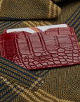 Flat leather credit card case with ID window, red croc, lifestyle