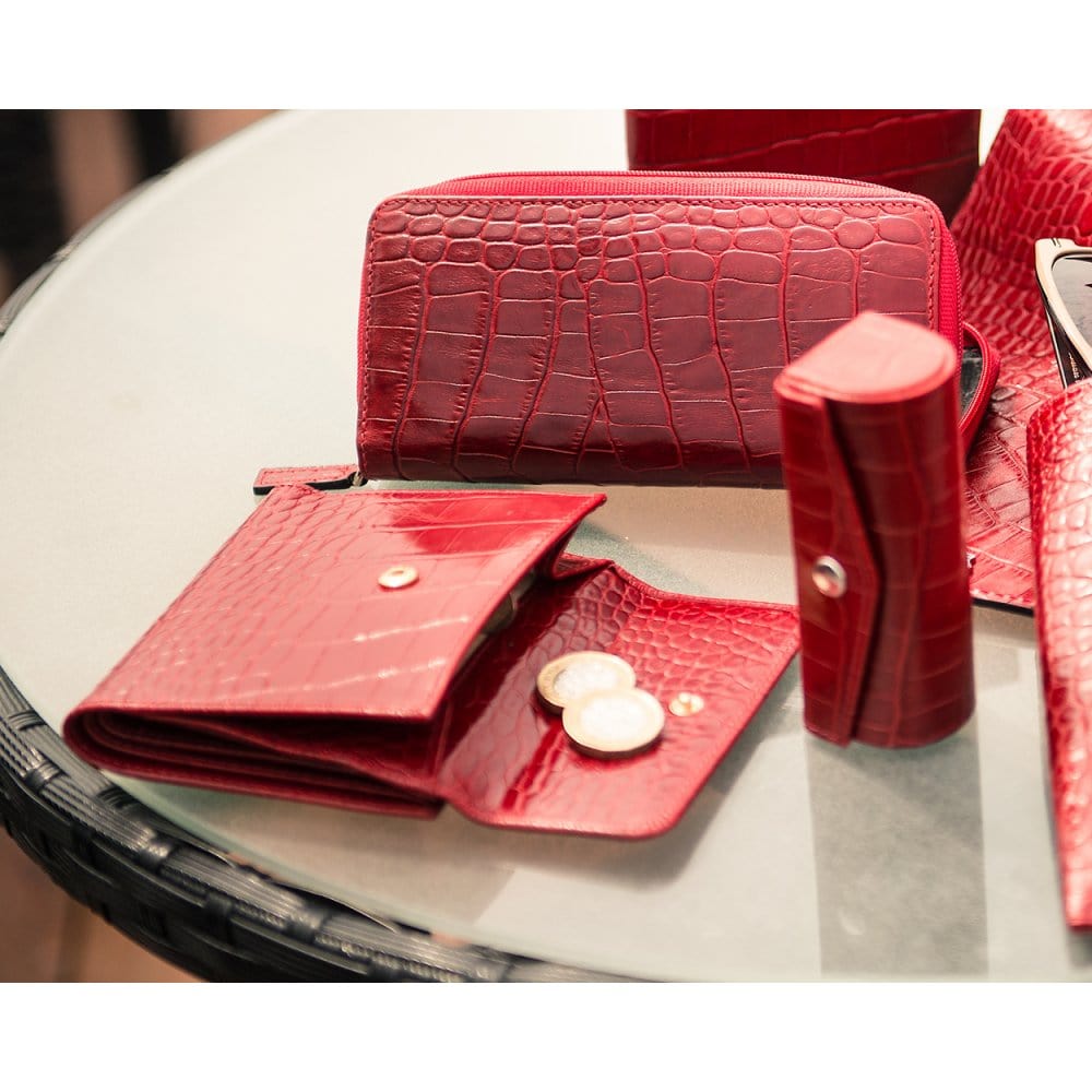 Leather purse with brass clasp, red croc, lifestyle