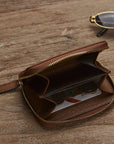 Small leather zip around coin purse, tan, lifestyle