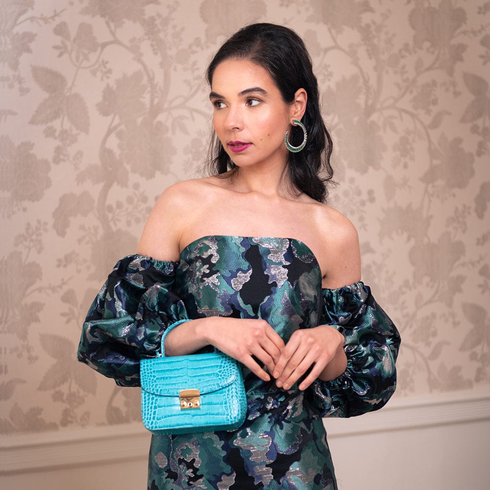 Mini top handle Betty Bag, cerise turquoise croc, lifestyle