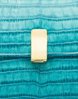 Leather top handle bag, turquoise croc, lock closeup