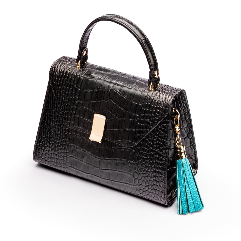 Decorative leather tassel, turquoise, on a bag