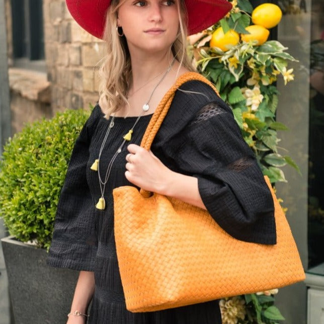 Woven leather slouchy bag, yellow, lifestyle
