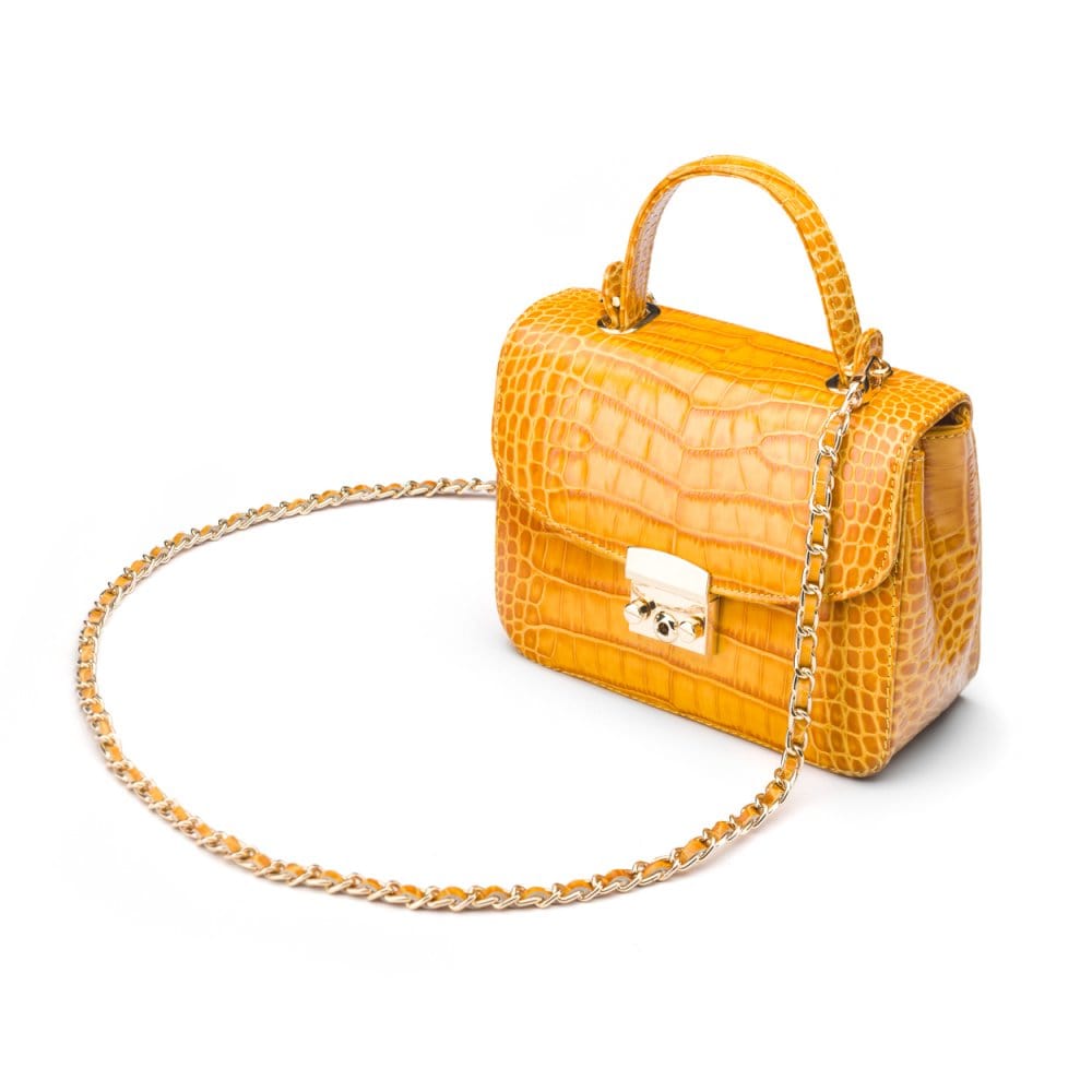 Small leather top handle bag, yellow croc, side