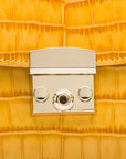 Small leather top handle bag, yellow croc, lock close up