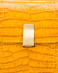 Leather top handle bag, yellow croc, lock closeup