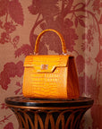 Mini leather Morgan Bag, top handle bag, yellow croc, lifestyle
