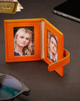 Mini leather passport photo frame, orange, 60 x 40mm, lifestyle