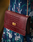 Small leather chain bag, burgundy croc, lifestyle view