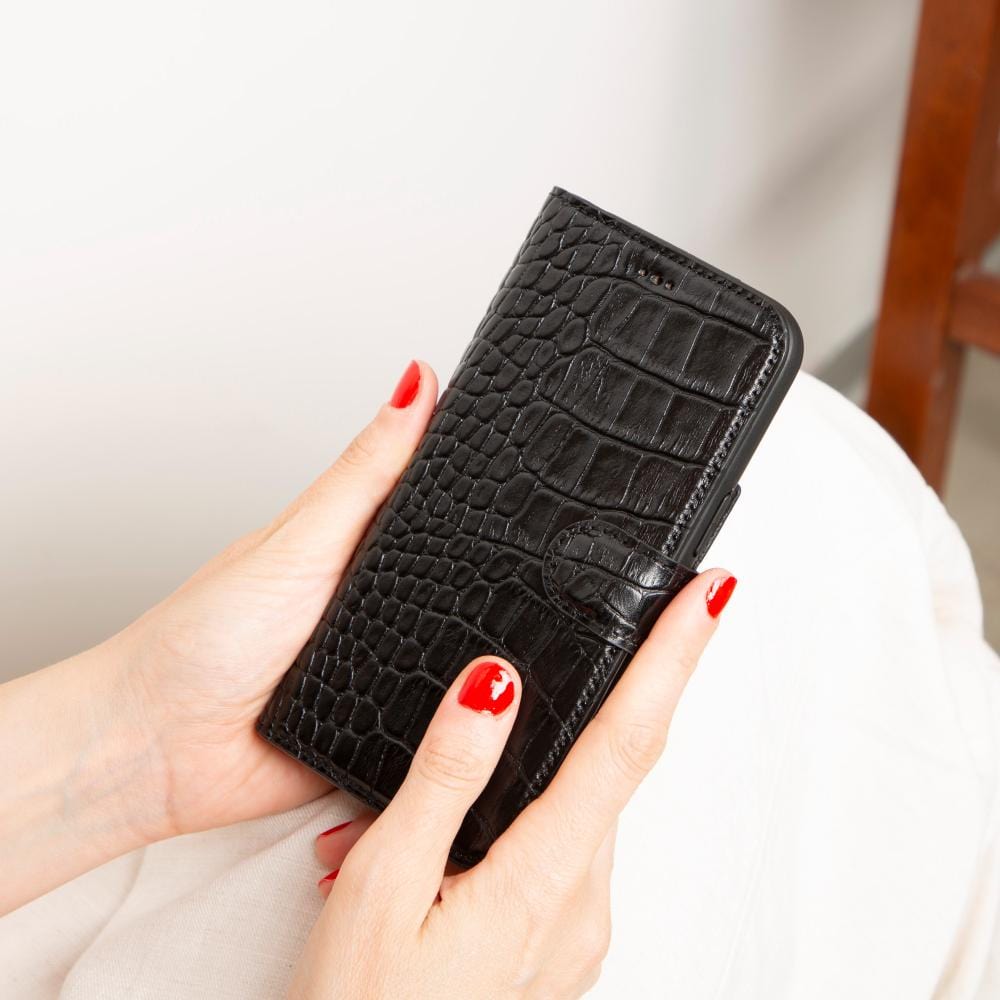 iPhone 15 case in leather with RFID, black croc, lifestyle