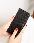 iPhone 15 case in leather with RFID, black croc, lifestyle