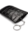 Leather key case with squeeze spring opening, black croc, back