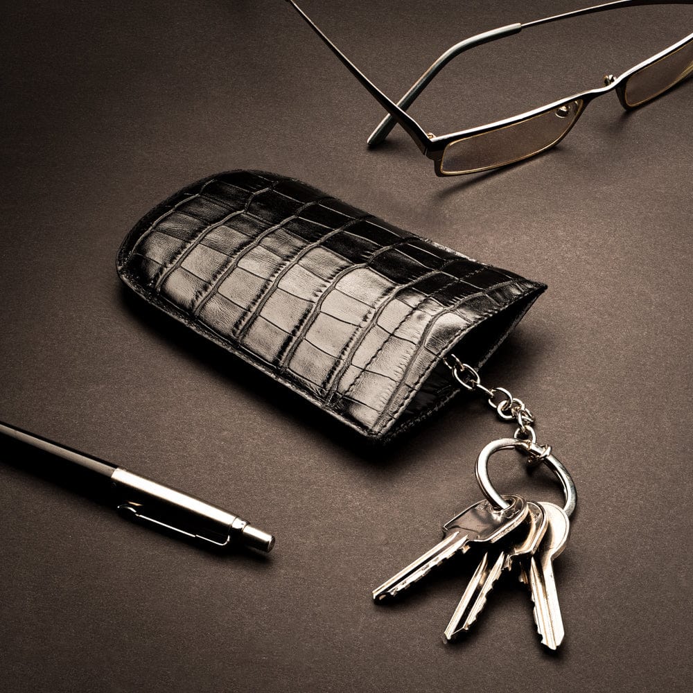 Leather key case with squeeze spring opening, black croc, lifestyle