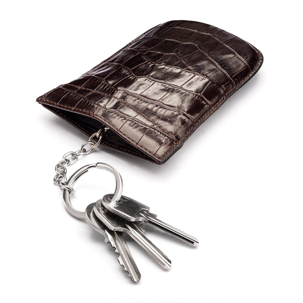 Leather key case with squeeze spring opening, brown croc, open